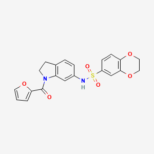 molecular formula C21H18N2O6S B3202534 N-(1-(furan-2-carbonyl)indolin-6-yl)-2,3-dihydrobenzo[b][1,4]dioxine-6-sulfonamide CAS No. 1021210-50-3
