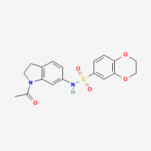molecular formula C18H18N2O5S B3203486 N-(1-acetylindolin-6-yl)-2,3-dihydrobenzo[b][1,4]dioxine-6-sulfonamide CAS No. 1021259-15-3