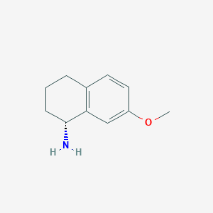 molecular formula C11H15NO B3204545 (1R)-7-methoxy-1,2,3,4-tetrahydronaphthalen-1-amine CAS No. 103791-15-7