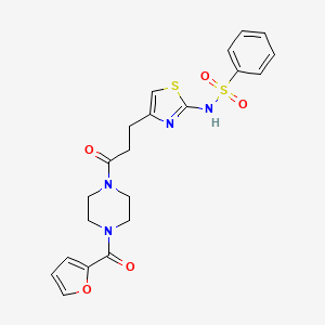 molecular formula C21H22N4O5S2 B3205054 N-(4-(3-(4-(furan-2-carbonyl)piperazin-1-yl)-3-oxopropyl)thiazol-2-yl)benzenesulfonamide CAS No. 1040639-50-6