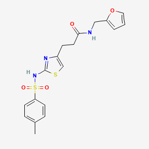 molecular formula C18H19N3O4S2 B3206483 N-(furan-2-ylmethyl)-3-(2-(4-methylphenylsulfonamido)thiazol-4-yl)propanamide CAS No. 1040669-65-5