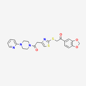 molecular formula C23H22N4O4S2 B3208054 1-(Benzo[d][1,3]dioxol-5-yl)-2-((4-(2-oxo-2-(4-(pyridin-2-yl)piperazin-1-yl)ethyl)thiazol-2-yl)thio)ethanone CAS No. 1049287-10-6