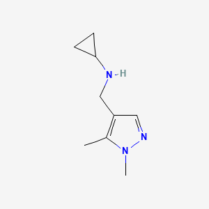 molecular formula C9H15N3 B3214794 N-[(1,5-dimethyl-1H-pyrazol-4-yl)methyl]cyclopropanamine CAS No. 1152879-32-7