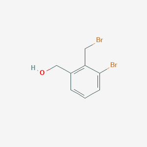 molecular formula C8H8Br2O B3218093 (3-Bromo-2-(bromomethyl)phenyl)methanol CAS No. 1187318-37-1