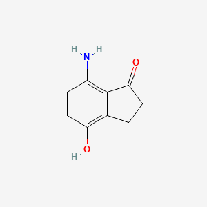 molecular formula C9H9NO2 B3222012 7-Amino-4-hydroxyindanone CAS No. 121062-94-0