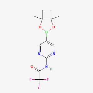 molecular formula C12H15BF3N3O3 B3223507 2,2,2-Trifluoro-N-(5-(4,4,5,5-tetramethyl-1,3,2-dioxaborolan-2-yl)pyrimidin-2-yl)acetamide CAS No. 1218789-37-7