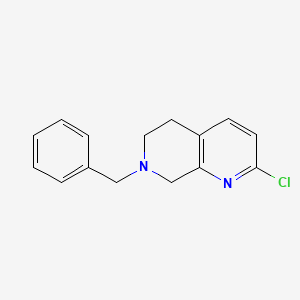 molecular formula C15H15ClN2 B3226557 1,7-Naphthyridine, 2-chloro-5,6,7,8-tetrahydro-7-(phenylmethyl)- CAS No. 1256803-65-2