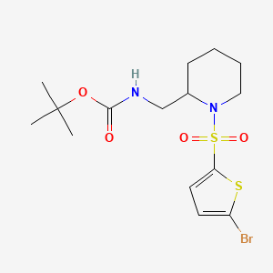 molecular formula C15H23BrN2O4S2 B3227986 [1-(5-Bromo-thiophene-2-sulfonyl)-piperidin-2-ylmethyl]-carbamic acid tert-butyl ester CAS No. 1261235-54-4