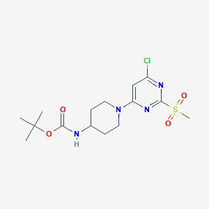 molecular formula C15H23ClN4O4S B3229745 [1-(6-Chloro-2-methanesulfonyl-pyrimidin-4-yl)-piperidin-4-yl]-carbamic acid tert-butyl ester CAS No. 1289386-82-8