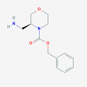 molecular formula C13H18N2O3 B3230884 (S)-Benzyl 3-(aminomethyl)morpholine-4-carboxylate hydrochloride CAS No. 1312161-61-7