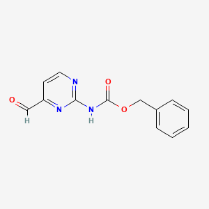 molecular formula C13H11N3O3 B3230936 Benzyl (4-formylpyrimidin-2-yl)carbamate CAS No. 1312764-26-3