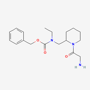 molecular formula C18H27N3O3 B3234079 [1-(2-Amino-acetyl)-piperidin-2-ylmethyl]-ethyl-carbamic acid benzyl ester CAS No. 1353962-76-1