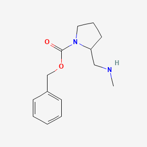 molecular formula C14H20N2O2 B3234135 2-Methylaminomethyl-pyrrolidine-1-carboxylic acid benzyl ester CAS No. 1353964-19-8