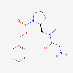 molecular formula C16H23N3O3 B3235154 (S)-2-{[(2-Amino-acetyl)-methyl-amino]-methyl}-pyrrolidine-1-carboxylic acid benzyl ester CAS No. 1353995-05-7