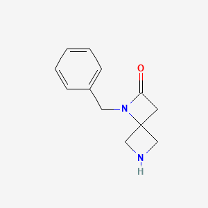 molecular formula C12H14N2O B3236157 1-Benzyl-1,6-diazaspiro[3.3]heptan-2-one CAS No. 1363405-85-9
