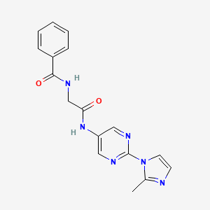 molecular formula C17H16N6O2 B3239659 N-(2-((2-(2-methyl-1H-imidazol-1-yl)pyrimidin-5-yl)amino)-2-oxoethyl)benzamide CAS No. 1421452-25-6