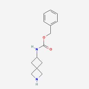 molecular formula C14H18N2O2 B3240588 Carbamic acid, N-2-azaspiro[3.3]hept-6-yl-, phenylmethyl ester CAS No. 1440962-13-9