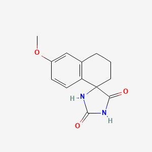 molecular formula C13H14N2O3 B3258277 6'-methoxy-3',4'-dihydro-2'H-spiro[imidazolidine-4,1'-naphthalene]-2,5-dione CAS No. 30265-10-2