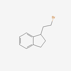 molecular formula C11H13B B3264054 1-(2-bromoethyl)-2,3-dihydro-1H-indene CAS No. 38434-35-4