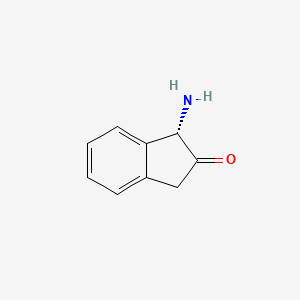 molecular formula C9H9NO B3267924 (S)-1-Amino-1H-inden-2(3H)-one CAS No. 473252-66-3