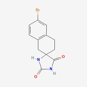molecular formula C12H11BrN2O2 B3277426 6'-Bromospiro[imidazolidine-5,2'-tetralin]-2,4-dione CAS No. 659736-46-6