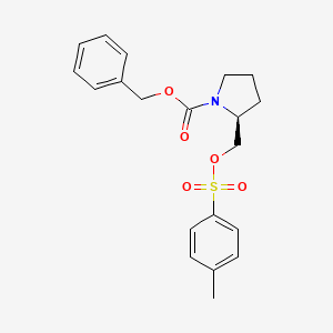 molecular formula C20H23NO5S B3280947 (S)-2-(Toluene-4-sulfonyloxymethyl)-pyrrolidine-1-carboxylic acid benzyl ester CAS No. 72500-24-4