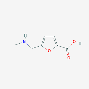 molecular formula C7H9NO3 B3296506 5-[(Methylamino)methyl]furan-2-carboxylic acid CAS No. 893740-52-8
