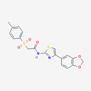 molecular formula C19H16N2O5S2 B3297391 N-(4-(benzo[d][1,3]dioxol-5-yl)thiazol-2-yl)-2-tosylacetamide CAS No. 895446-55-6