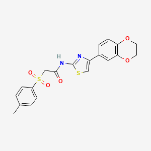 molecular formula C20H18N2O5S2 B3297411 N-(4-(2,3-dihydrobenzo[b][1,4]dioxin-6-yl)thiazol-2-yl)-2-tosylacetamide CAS No. 895447-40-2