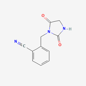 molecular formula C11H9N3O2 B3305445 2-[(2,5-Dioxoimidazolidin-1-yl)methyl]benzonitrile CAS No. 923191-32-6