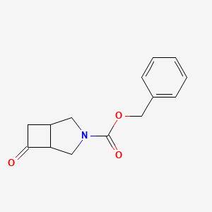 molecular formula C14H15NO3 B3323551 3-Cbz-6-oxo-3-azabicyclo[3.2.0]heptane CAS No. 1638771-52-4