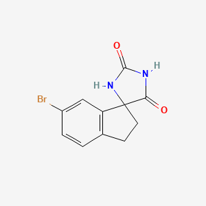 molecular formula C11H9BrN2O2 B3324508 5-Bromospiro[1,2-dihydroindene-3,5'-imidazolidine]-2',4'-dione CAS No. 1880205-67-3