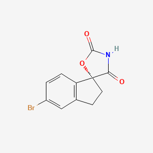 molecular formula C11H8BrNO3 B3324555 (R)-5-bromo-2,3-dihydrospiro[indene-1,5'-oxazolidine]-2',4'-dione CAS No. 1889289-92-2