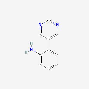molecular formula C10H9N3 B3338362 2-(5-Pyrimidinyl)aniline CAS No. 893735-92-7