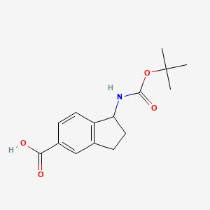 molecular formula C15H19NO4 B3377926 1-((tert-Butoxycarbonyl)amino)-2,3-dihydro-1H-indene-5-carboxylic acid CAS No. 1365158-55-9