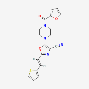 (E)-5-(4-(furan-2-carbonyl)piperazin-1-yl)-2-(2-(thiophen-2-yl)vinyl)oxazole-4-carbonitrile