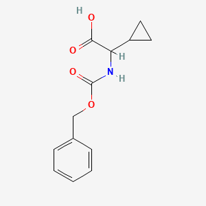 molecular formula C13H15NO4 B3419858 Benzyloxycarbonylamino-cyclopropyl-acetic acid CAS No. 159871-55-3