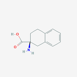 molecular formula C11H13NO2 B034306 (S)-2-Amino-1,2,3,4-tetrahydro-2-naphthalenecarboxylic acid CAS No. 104974-45-0