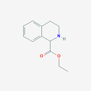 molecular formula C12H15NO2 B035203 Ethyl 1,2,3,4-tetrahydroisoquinoline-1-carboxylate CAS No. 106181-28-6