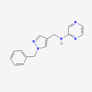 molecular formula C15H15N5 B3798542 N-[(1-benzyl-1H-pyrazol-4-yl)methyl]-2-pyrazinamine 