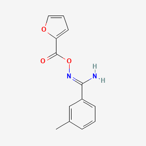 molecular formula C13H12N2O3 B3905545 N'-(2-furoyloxy)-3-methylbenzenecarboximidamide 