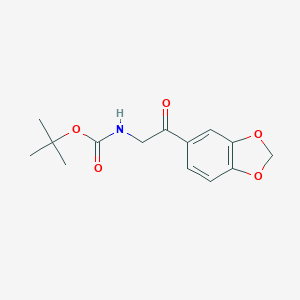 molecular formula C14H17NO5 B039474 (2-Benzo[1,3]dioxol-5-YL-2-oxo-ethyl)-carbamic acid tert-butyl ester CAS No. 121505-99-5