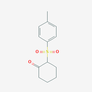 2-(4-Methylbenzenesulfonyl)cyclohexan-1-one