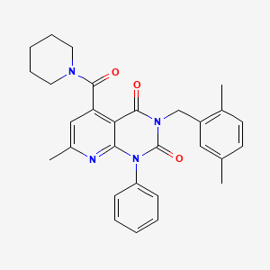 3-[(2,5-DIMETHYLPHENYL)METHYL]-7-METHYL-1-PHENYL-5-(PIPERIDINE-1-CARBONYL)-1H,2H,3H,4H-PYRIDO[2,3-D]PYRIMIDINE-2,4-DIONE