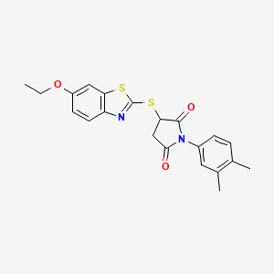 1-(3,4-Dimethylphenyl)-3-[(6-ethoxy-1,3-benzothiazol-2-yl)sulfanyl]pyrrolidine-2,5-dione