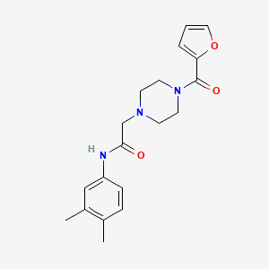 N-(3,4-dimethylphenyl)-2-[4-(furan-2-carbonyl)piperazin-1-yl]acetamide