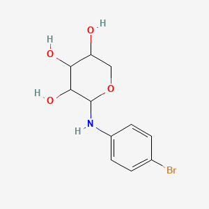 2-(4-Bromoanilino)oxane-3,4,5-triol