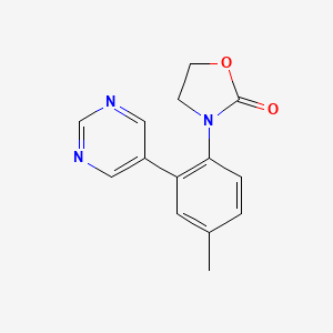molecular formula C14H13N3O2 B5618859 3-(4-methyl-2-pyrimidin-5-ylphenyl)-1,3-oxazolidin-2-one 