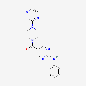 molecular formula C19H19N7O B5628499 N-phenyl-5-{[4-(2-pyrazinyl)-1-piperazinyl]carbonyl}-2-pyrimidinamine 