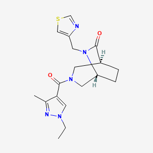 molecular formula C18H23N5O2S B5628836 (1S*,5R*)-3-[(1-ethyl-3-methyl-1H-pyrazol-4-yl)carbonyl]-6-(1,3-thiazol-4-ylmethyl)-3,6-diazabicyclo[3.2.2]nonan-7-one 